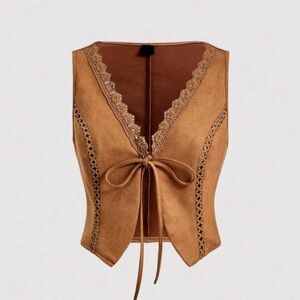 vest-style jacket with lace trim and bow on the front